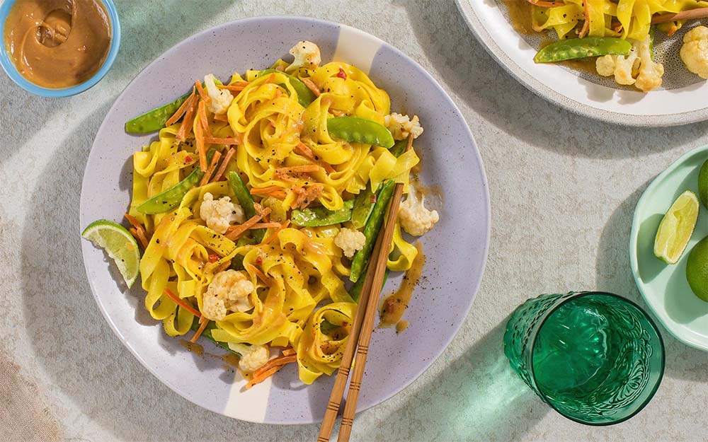 Creamy Peanut Pad Thai with cauliflower, snow peas and lime,